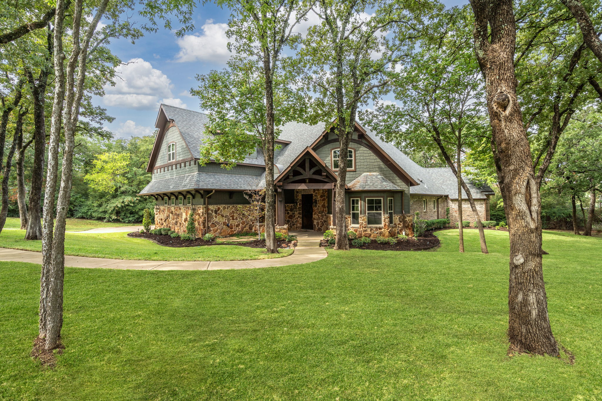 Custom built home on almost 2 acres of private wooded land with mature trees.